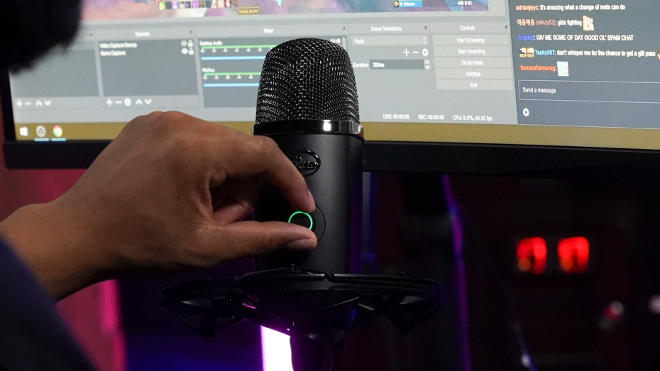 person-adjusting-yeti-x-microphone-smart-knob